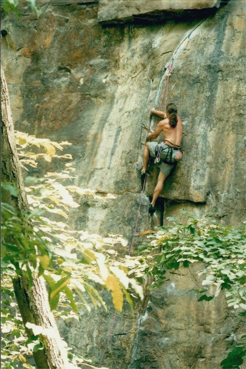 Martyn Church climbing a rock face