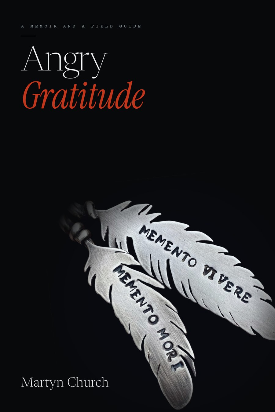 Angry Gratitude by Martyn Church, working cover: a pair of hand-stamped silver feathers reading memento mori and memento vivere