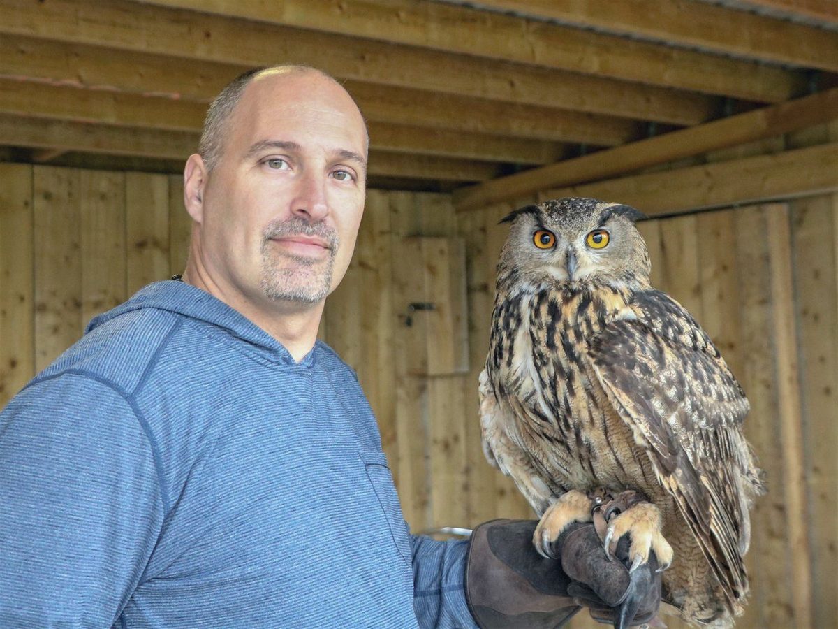 Martyn Church with an eagle-owl perched on his gloved hand